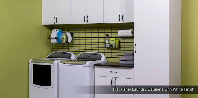 Laundry room organization with metal baskets and white flat panel cabinets